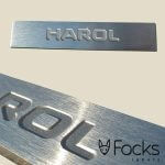 Nameplate brushed stainless steel, deeply etched, with adhesive.