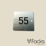 Number label aluminium, in stainless steel look, engraved and lacquered in black.