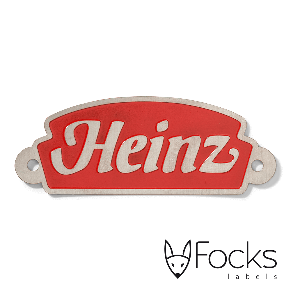 Naamlabel Heinz voor sales promotion, RVS geëtst, achtergrond rood ingelakt, voorzien van 2 boorgaten.